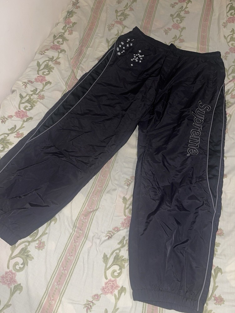 Supreme AOI Glow in the Dark Track Pants for Nighttime Visibility