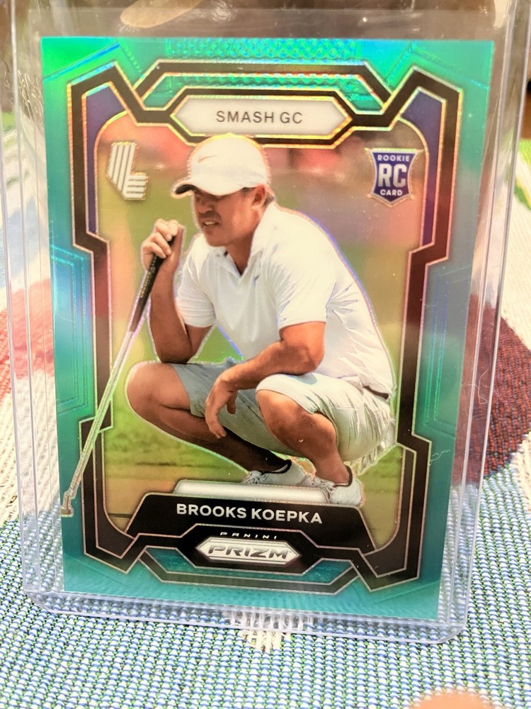 2024 Panini Prizm LIV Golf Brooks Koepka RC Rookie Teal Prizm 086/199