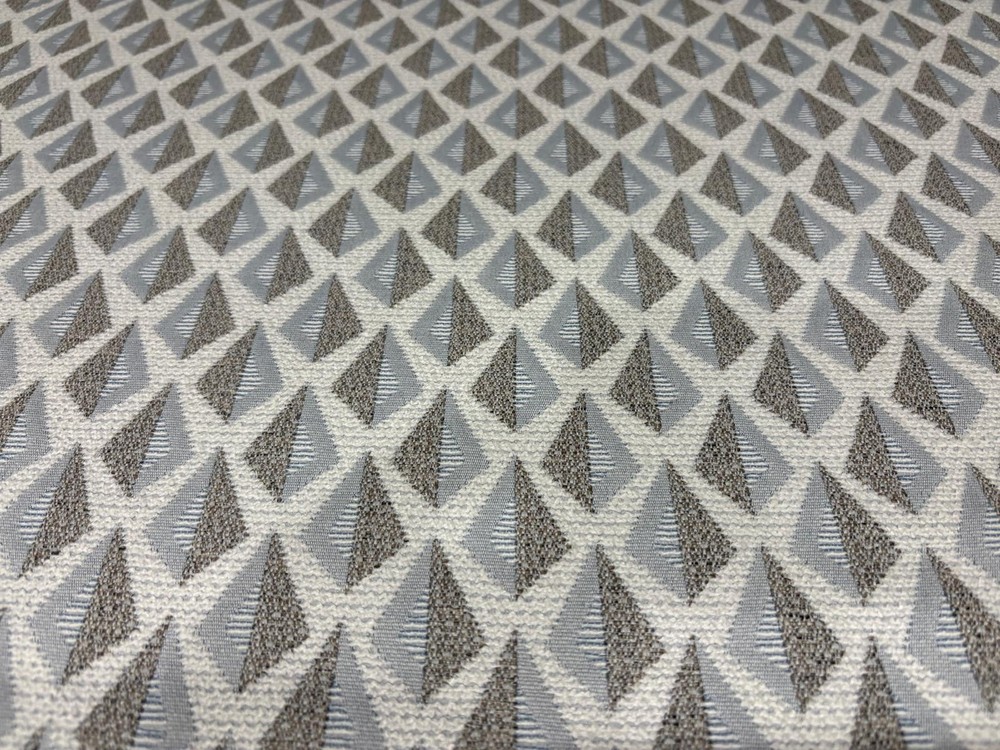ROLL END 4.3 METRES OF A GEOMETRIC DESIGN WOVEN UPHOLSTERY FABRIC IN GREY /TAUPE