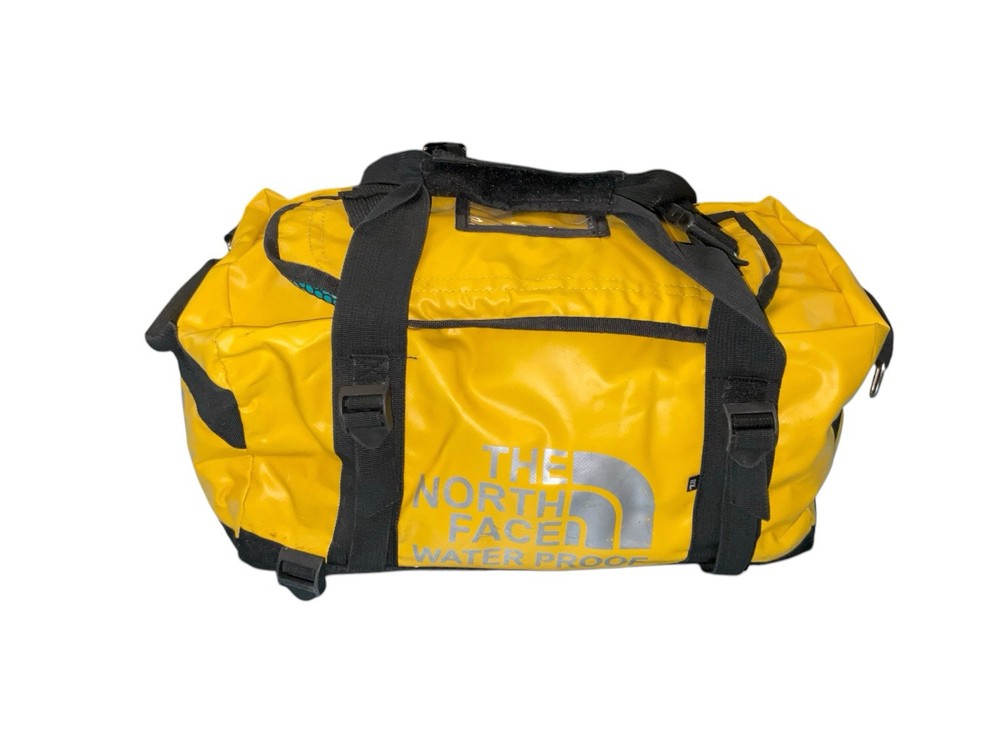 The North Face Yellow Waterproof Base Camp Duffel Bag with Vinyl Coating for Hiking