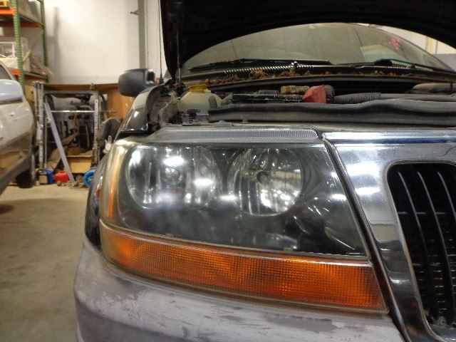 Smoke Tint Headlight Cover for 99-02 Grand Cherokee 2053839 Dark Background