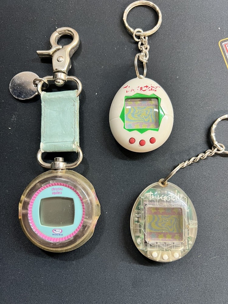 2 Tamagotchi and 1 Christina Aguilera Watch Rocks