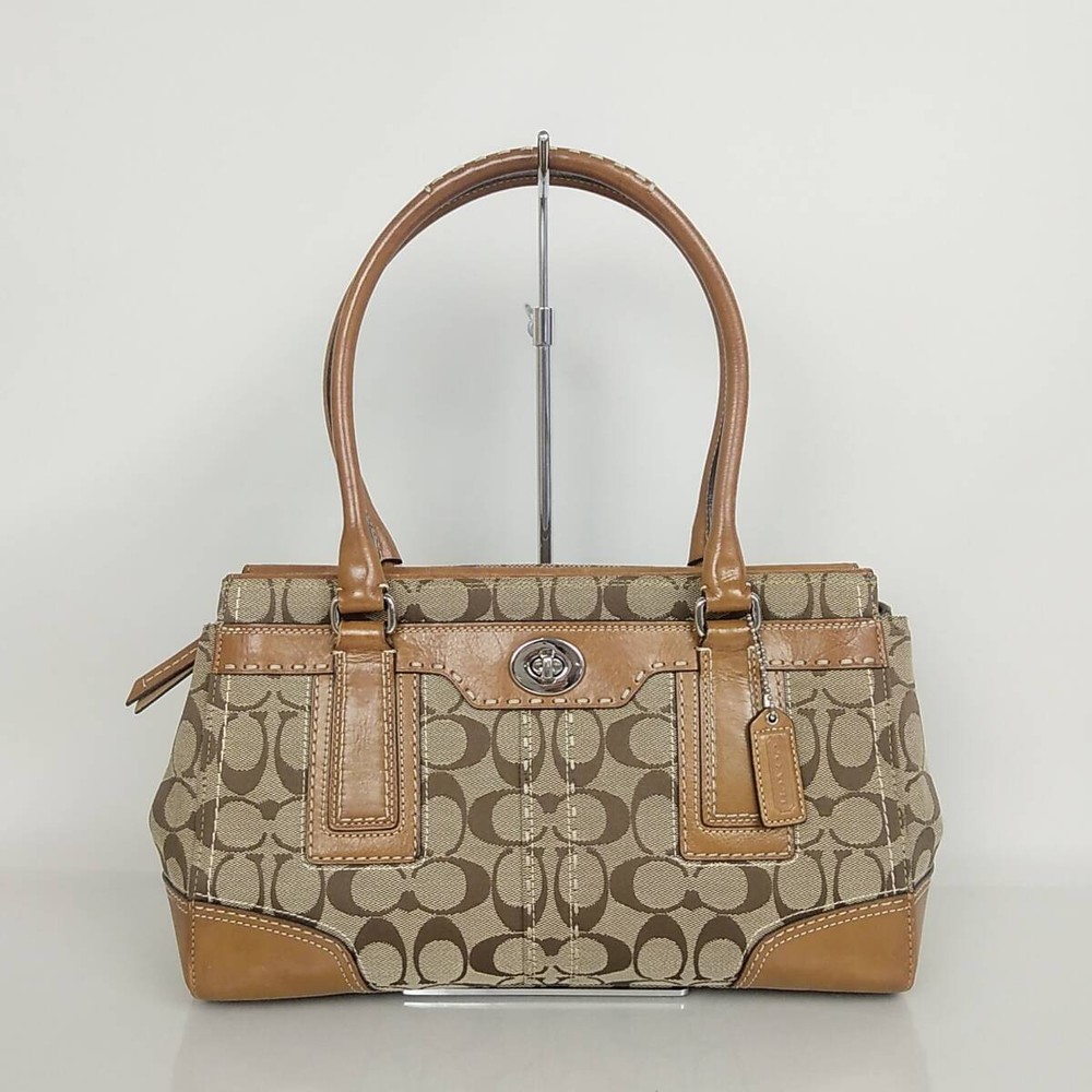 73B255 Coach Signature Brown Turn Lock Handbag