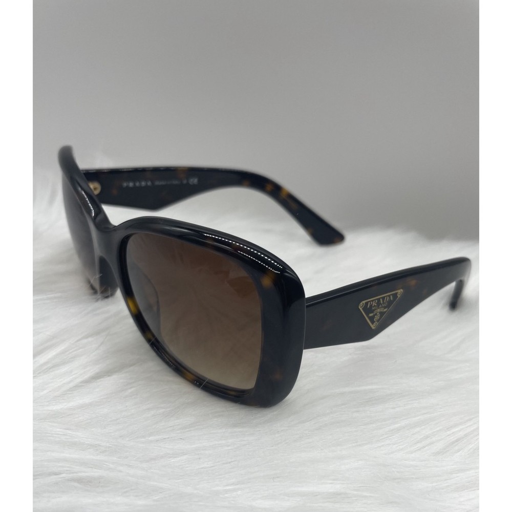 Prada logo sunglasses in tortoiseshell pattern good condition  