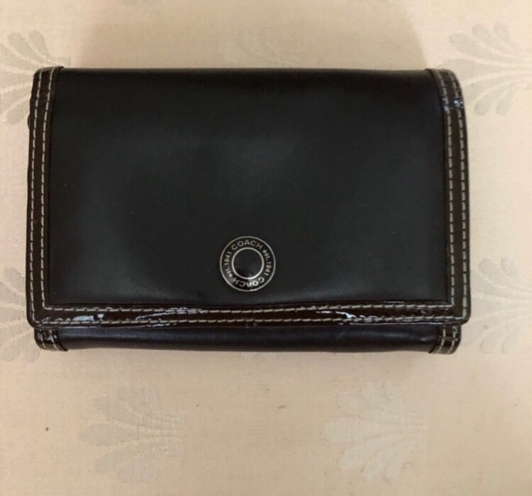 Chocolate brown leather Coach wallet with premium craftsmanship