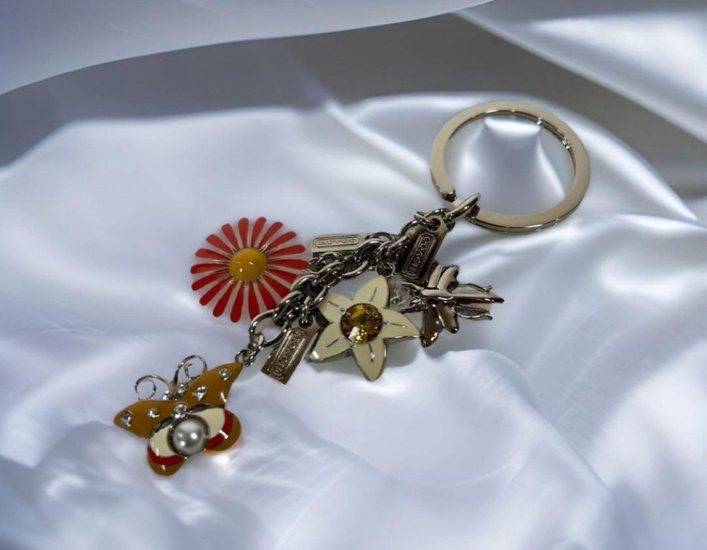 Coach Butterfly & Floral Rhinestone Keychain in Yellow & Orange