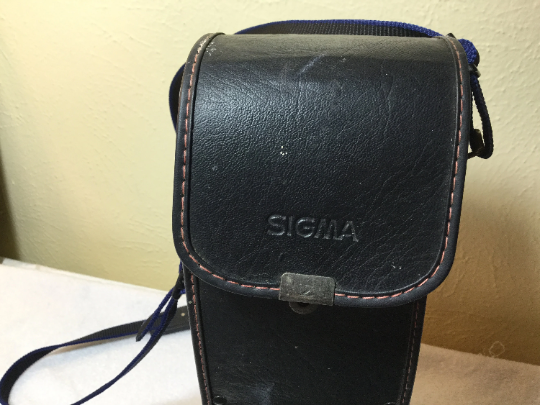 Vintage Sigma telephoto lens with included carrying case