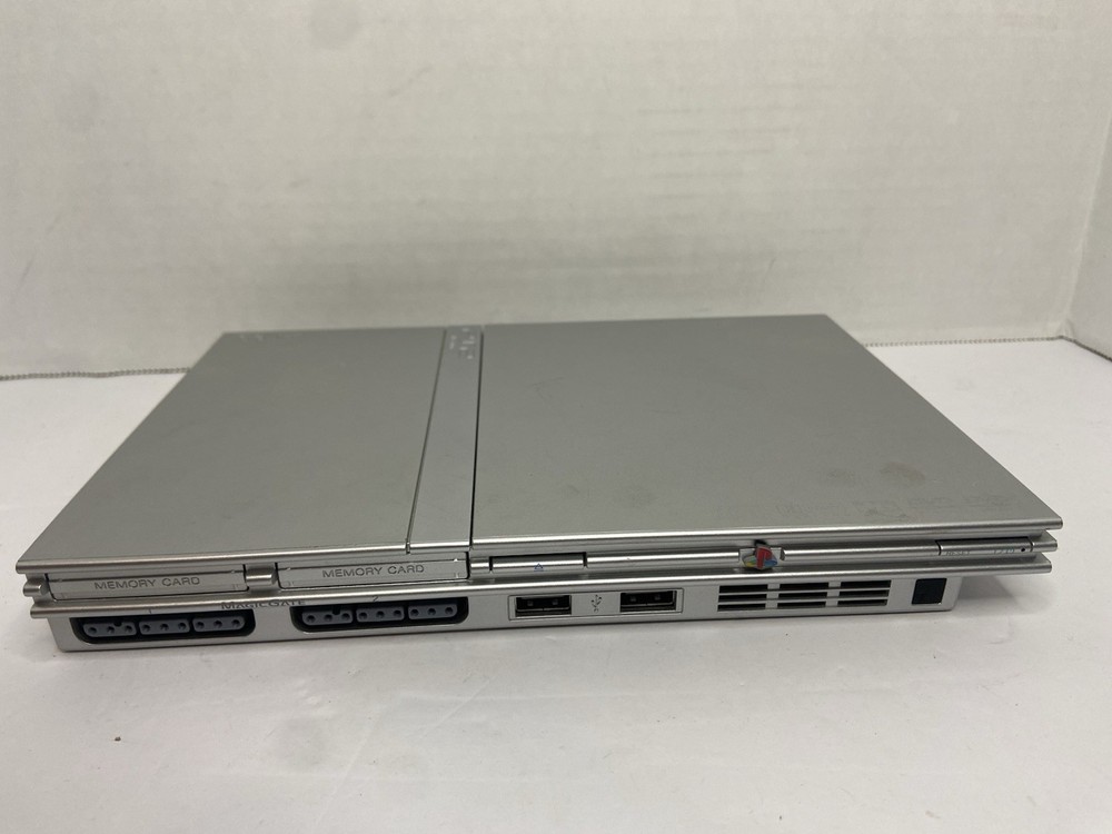 Silver PS2 Slim 79001 For Parts/Repair - Powers On But Won't Read Discs