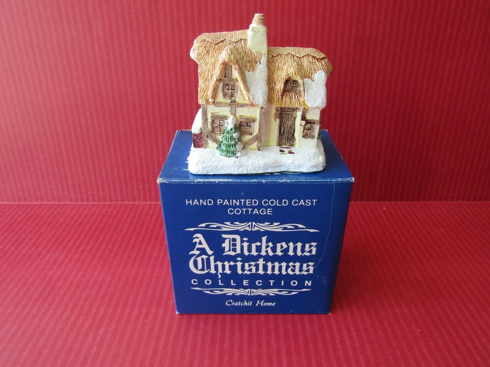 A Dickens Christmas Collection Hand Painted Cold Cast Cottage Cratchit Home