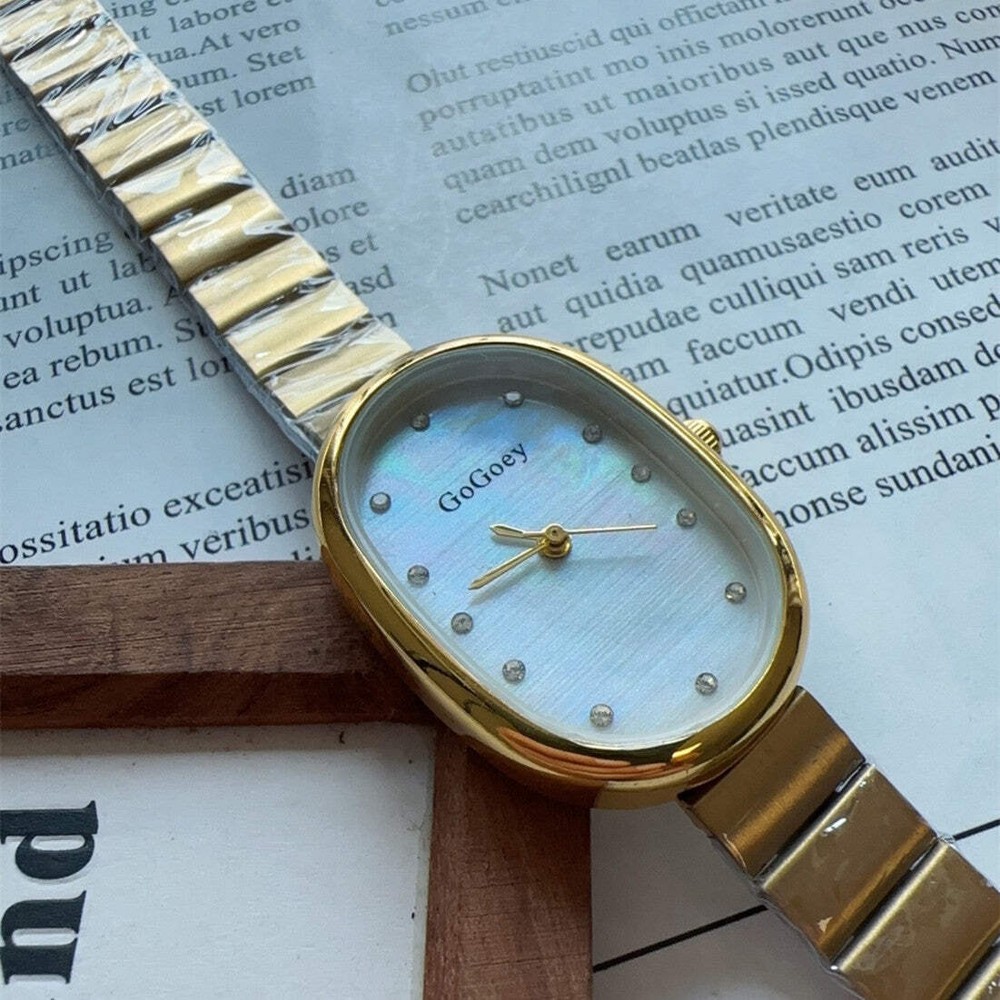 Women's Round Dial Steel Belt Watch with Oval Disk Shell Surface and Spot Drill