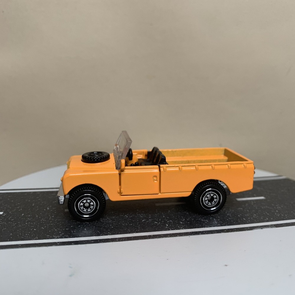 2023 Matchbox Moving Parts 1965 Land Rover II Pickup Truck Open Top Orange 1:64