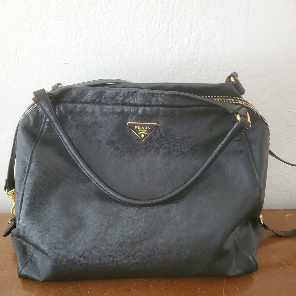 PRADA Saffiano Black Leather Handbag with Gold Accents and Secure Zipper