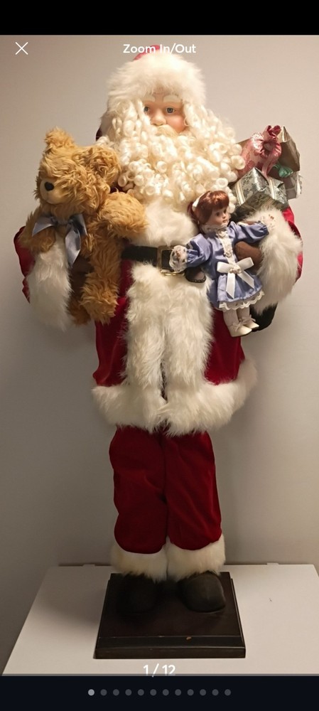 This is A 4ft life-sized decorative Santa Claus figure. The figure is shown...