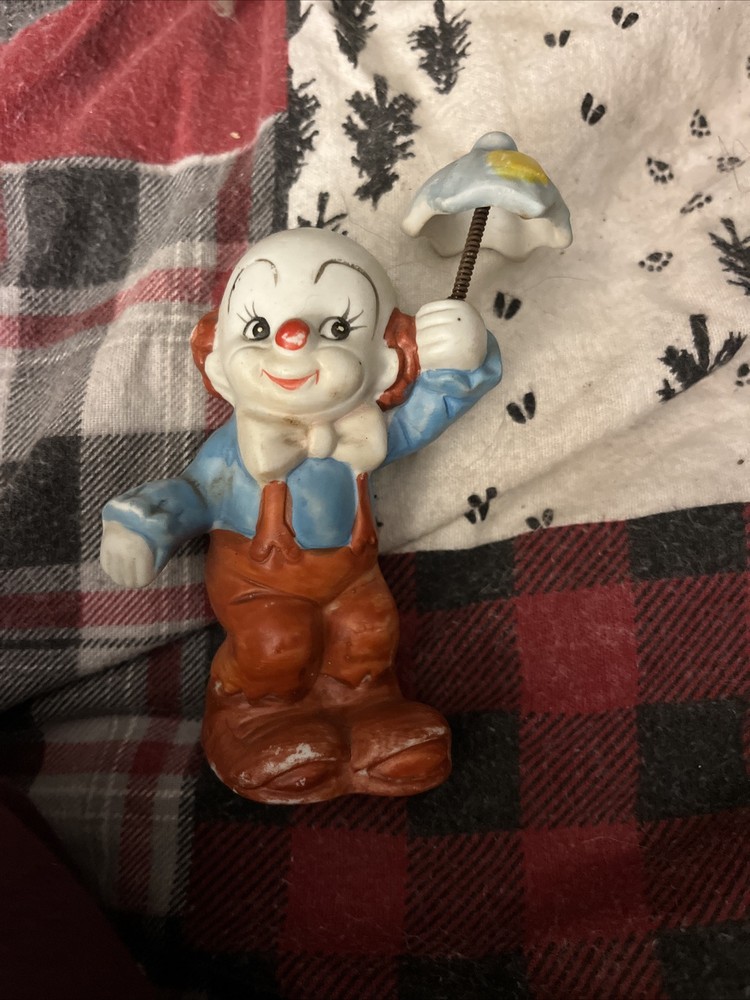 Porcelain Clown Figurine Holding a Colorful Umbrella
