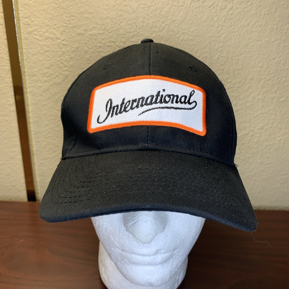 International stretch fit black baseball cap with embroidered patch logo