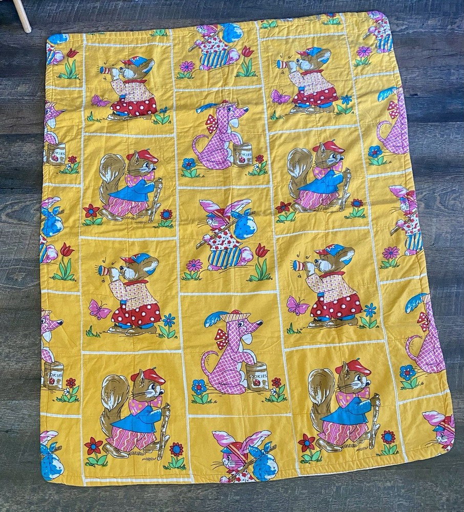 vintage handmade quilted baby blanket featuring anthropomorphic animals
