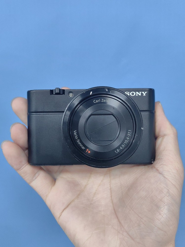 Sony RX100 20.2 MP 3.6x Optical Zoom Compact Digital Camera with Charger