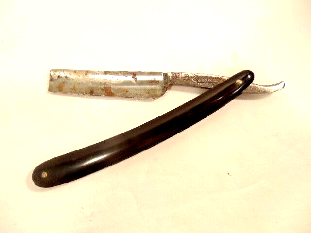 older straight razor labeled 