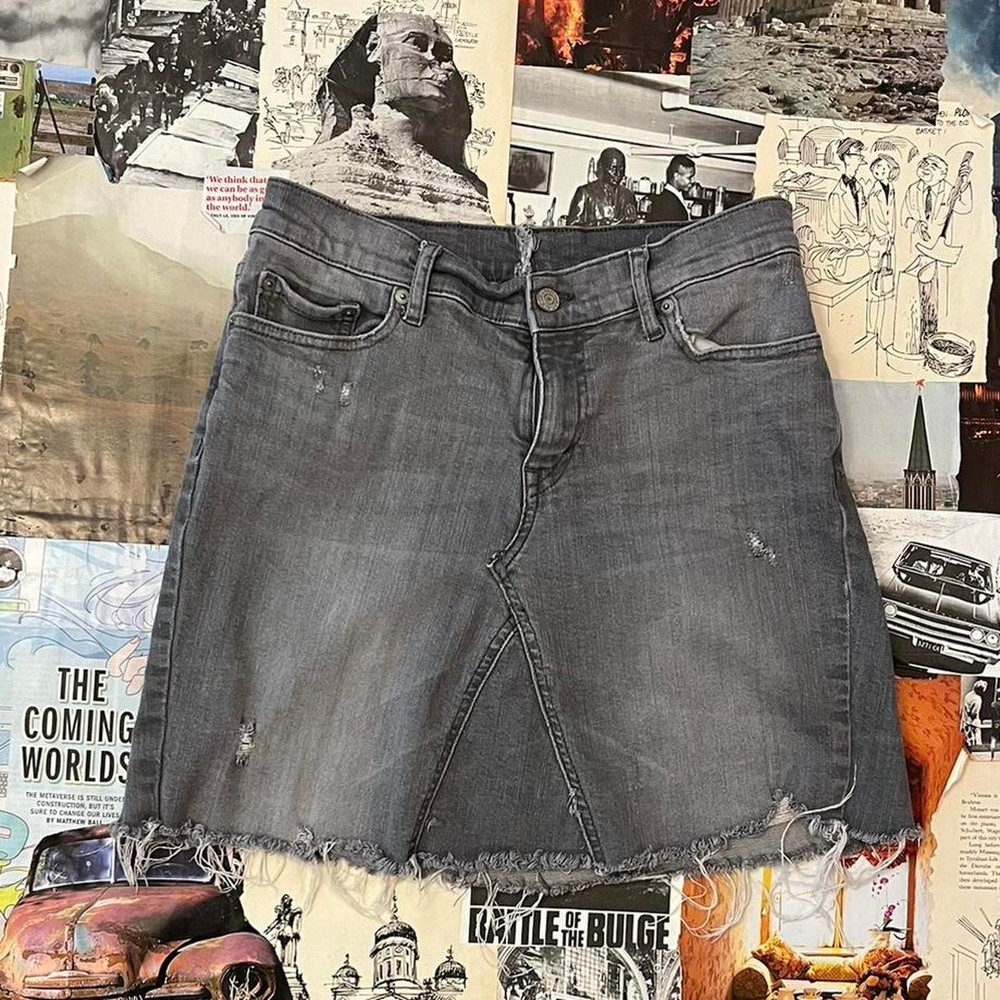 Distressed grey denim mini skirt with raw hem