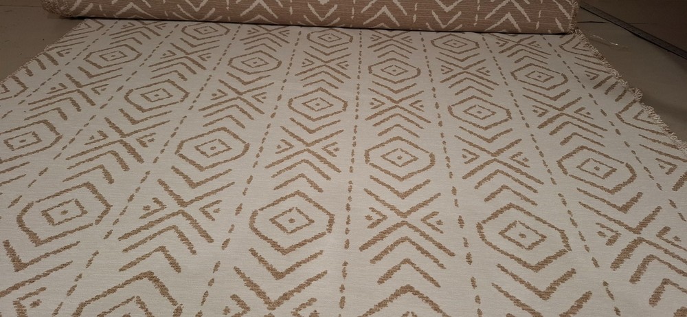 ROLL END 5.9 METRE OF CREAM AND BEIGE IKAT DESIGN WOVEN UPHOLSTERY FABRIC