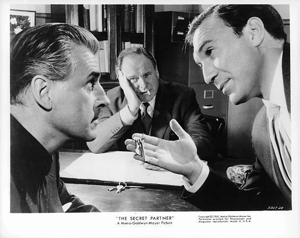 Bernard Lee with a cigarette in his mouth watching two unknown act- Old Photo