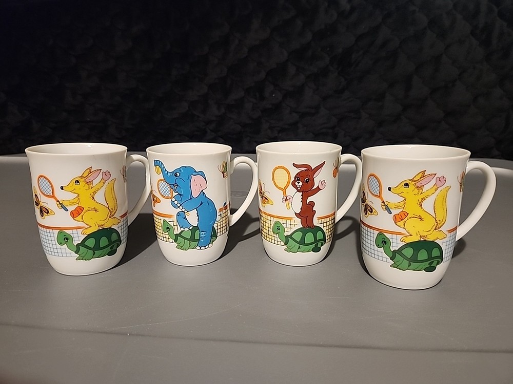 Four Vintage Potpourri Press Mugs Featuring Cartoon Animals Playing Tennis.