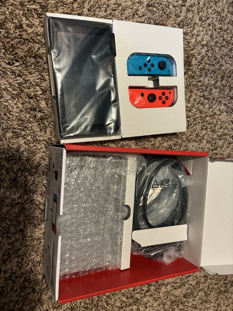 Brand New Switch Gen2 Red And Blue Comes With Zelda Case 32gb Wi-fi Compatible.