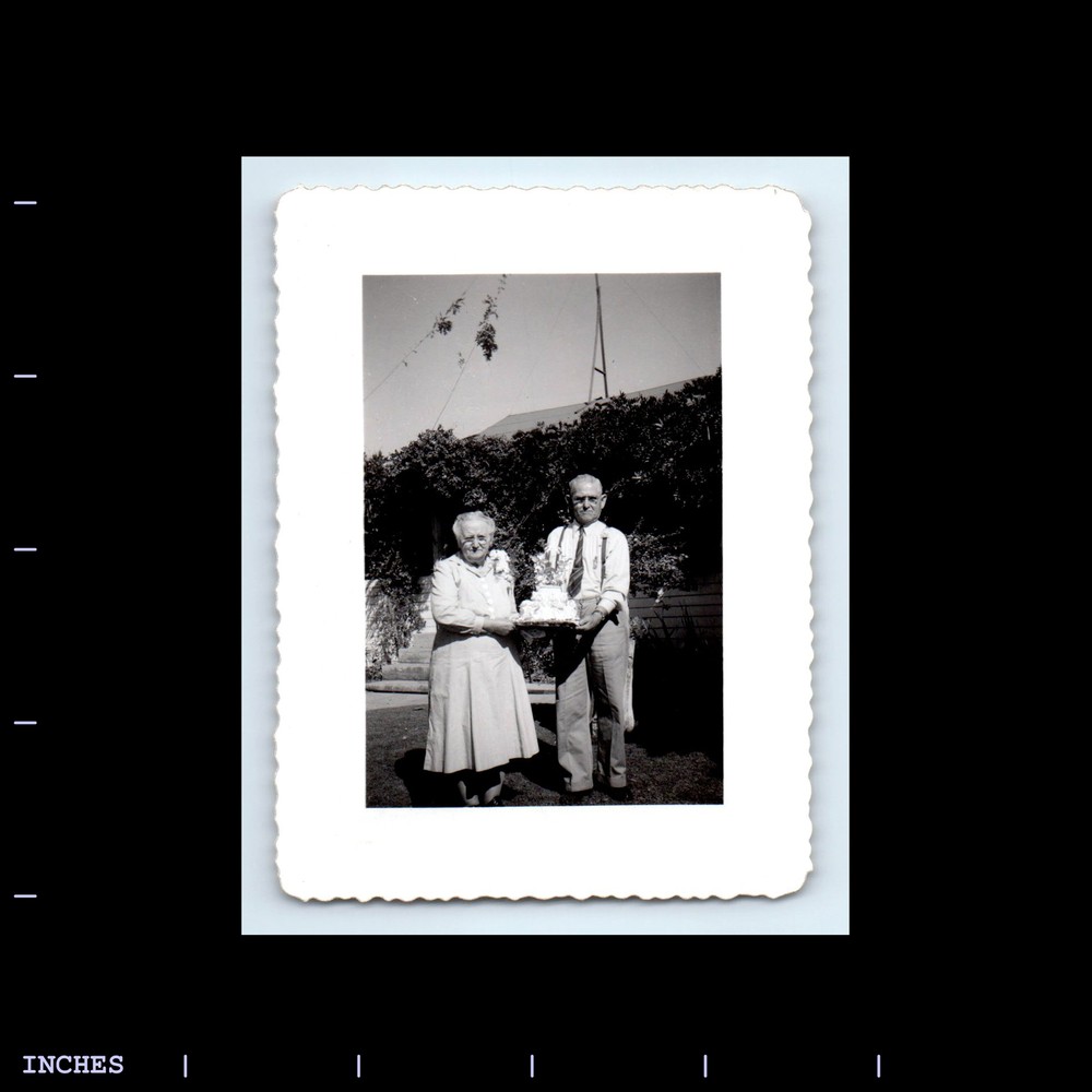 Vintage Man and Woman Holding Cake Wedding Anniversary Photo