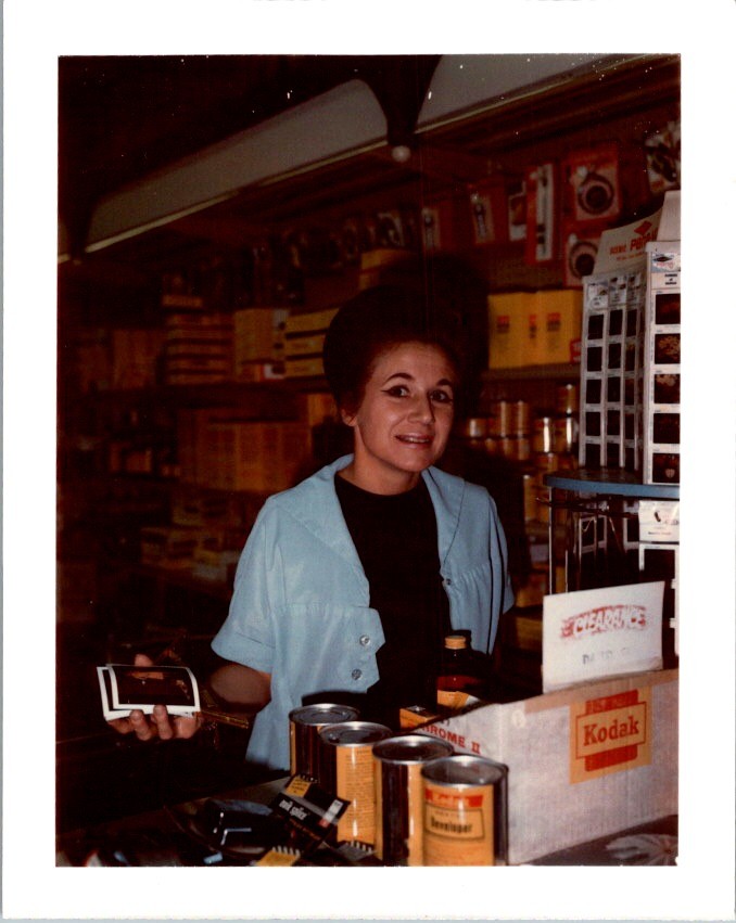 1970s Photograph Camera Shop Clerk With Kodak Film Stock Clearance Sale-image