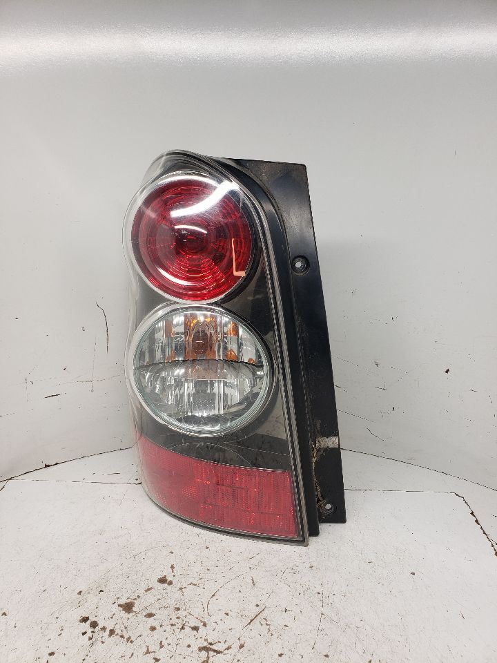 04-06 Mazda MPV Tail Light Bar Grille Rear Bumper Moulding 1324700
