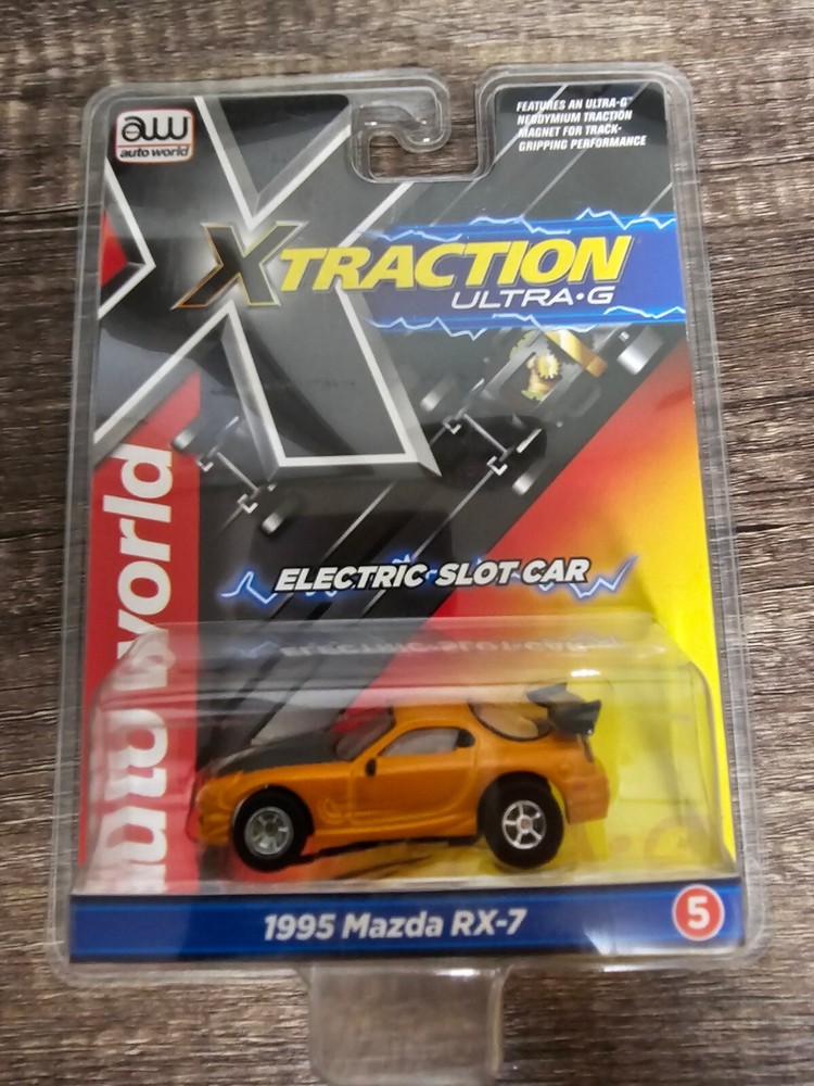 Autoworld HO Slot Car New X Traction 1995 Mazda RX7 Orange