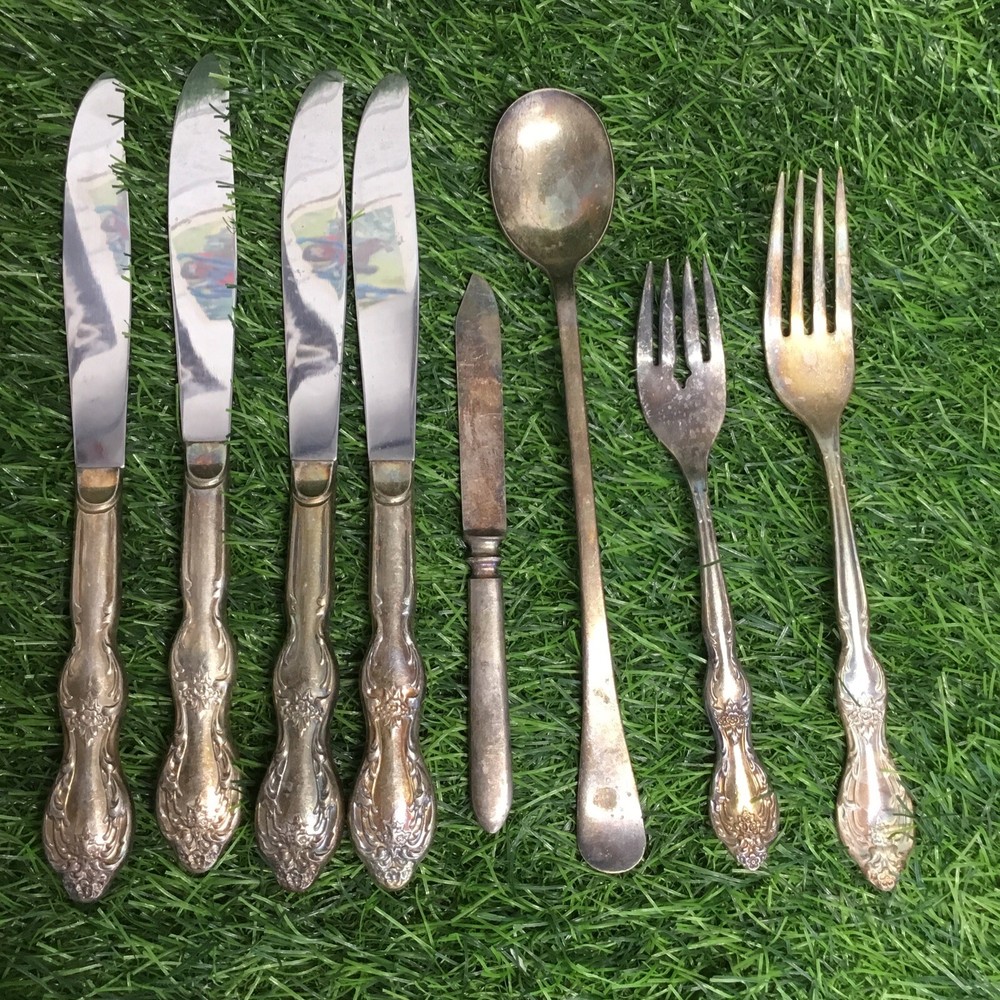 LOT OF 8 SILVERWARE PIECES.                                BB