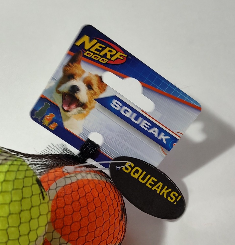NERF DOG BY HASBRO. FOUR MINI TENNIS BALLS THAT BOUNCE AND SQUEAK WHEN BITTEN. .