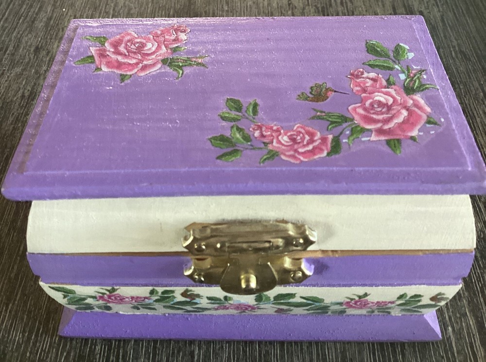 Vintage handcrafted wooden trinket box with ornate detailing