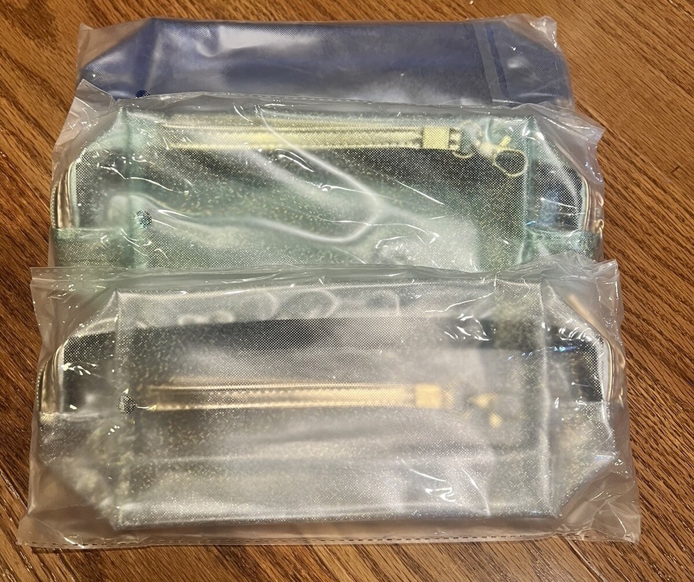 New In Package Set Of 3 Waterproof Cosmetic Wristlet Bags Translucent Metallic