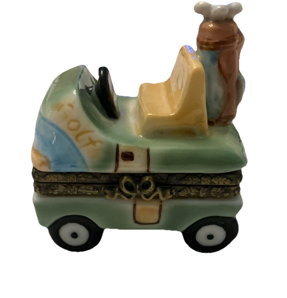 Golf-themed trinket box in green, blue, and yellow hues