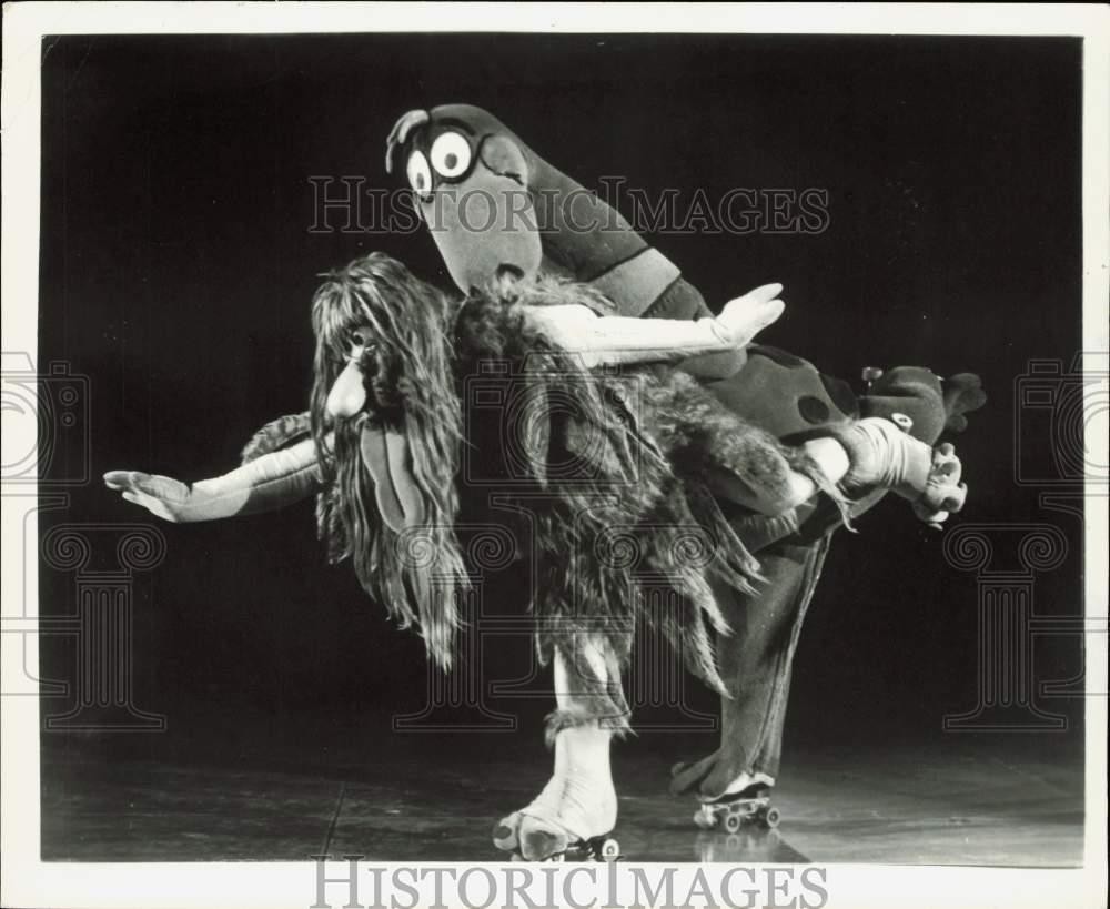 1979 Press Photo Flintstones pet Dino and Captain Caveman on rollerskates