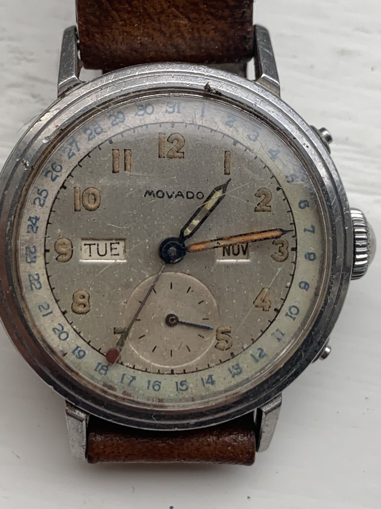 VINTAGE & VERY RARE,  MOVADO TRIPLE DATE . COLLECTORS ITEM, REQUIRES SERVICE.