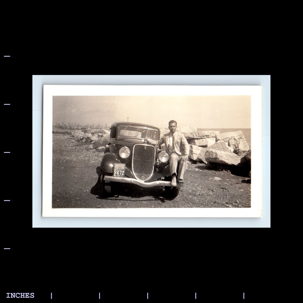 Vintage 1935 photo of a man by classic car at Chicago World's Fair