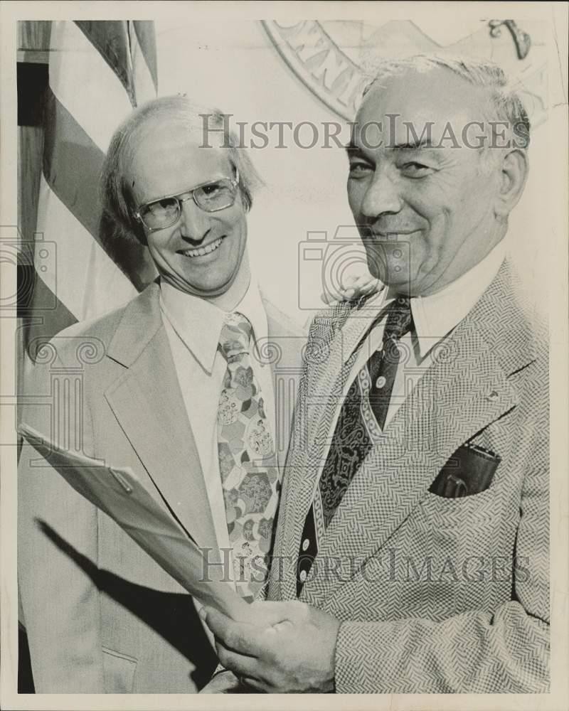 1976 Press Photo Two Men with Paperwork - sra39332