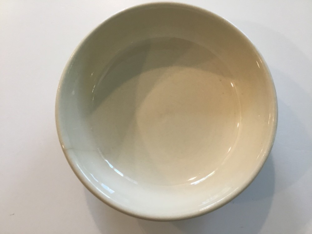 1413 McCoy Bowl USA Beige with two dark brown stripes. Crack on side.