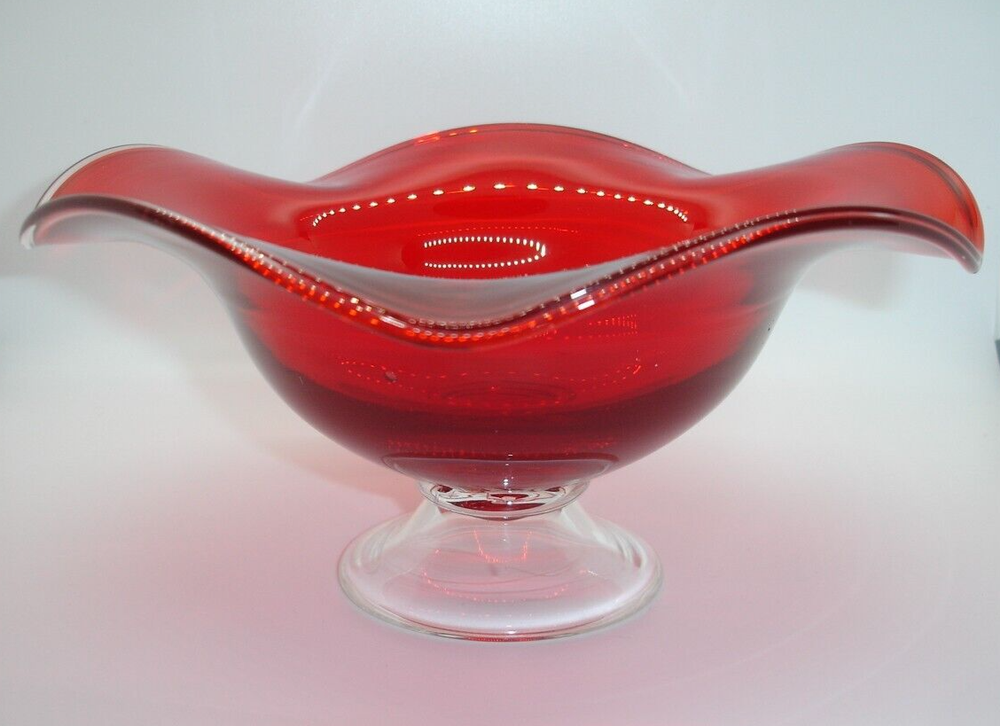 Footed deep ruby red art glass bowl with wavy floral rim for fruit or candy