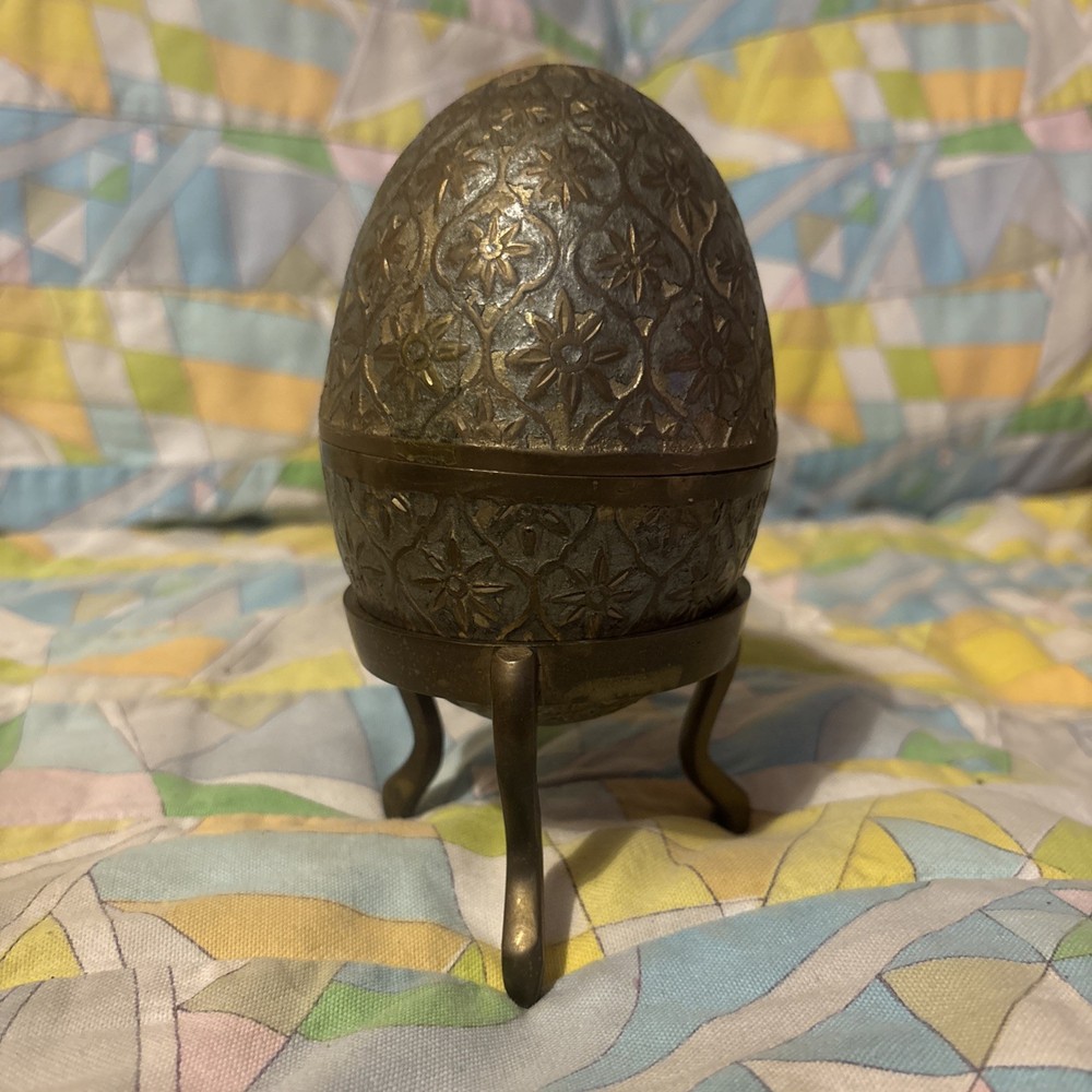 vintage brass Or cloisonné-style egg trinket box on a stand