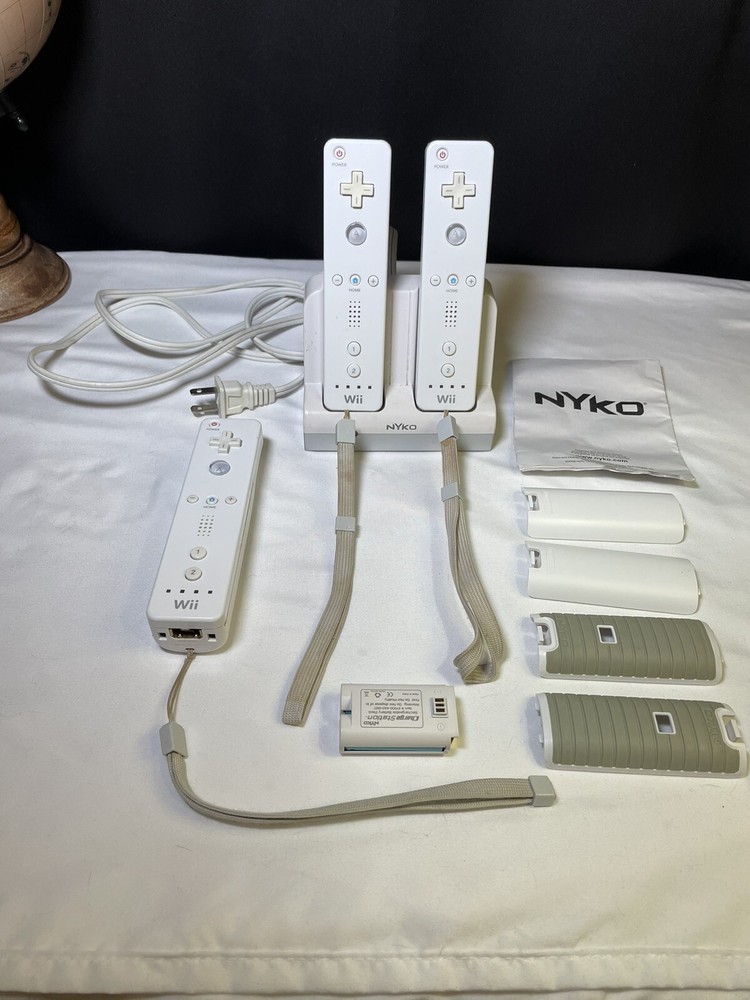 Lot of 3 OEM Nintendo Wii Remotes, Nyko Charge Station And Extra Backings Lot