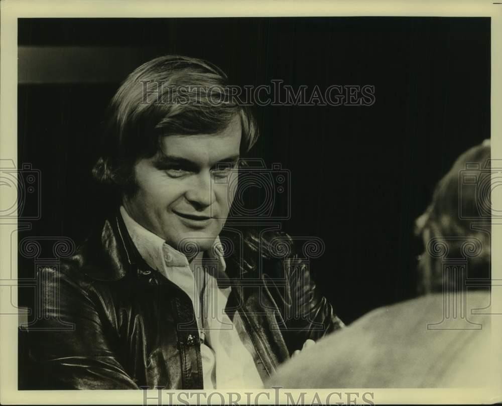 Press Photo An actor in a scene on a television show or a movie. - sap49240