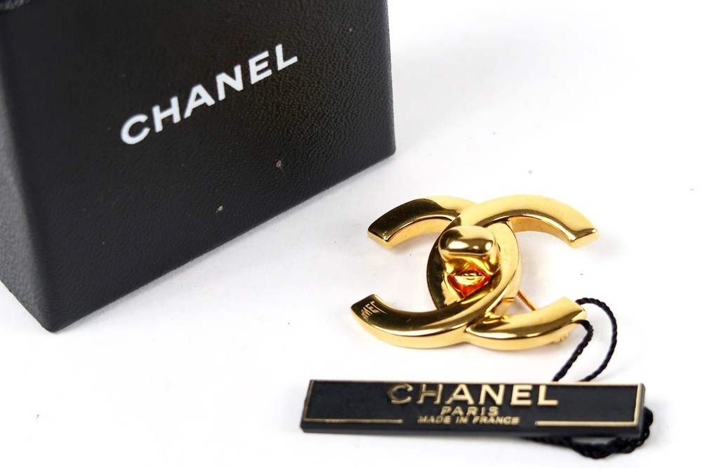 CHANEL Coco Mark Turn Lock Brooch 96P Engraved Gold 704448