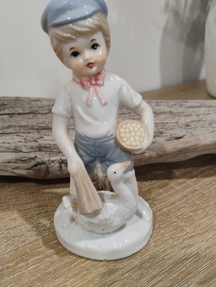 Vintage Porcelain Boy Figurine Sitting on Stump Collecting Eggs