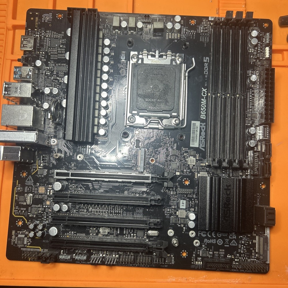 ASRock B650M-CX AMD AM5 DDR5 Micro-ATX Motherboard With Missing Ram And Pie Clip