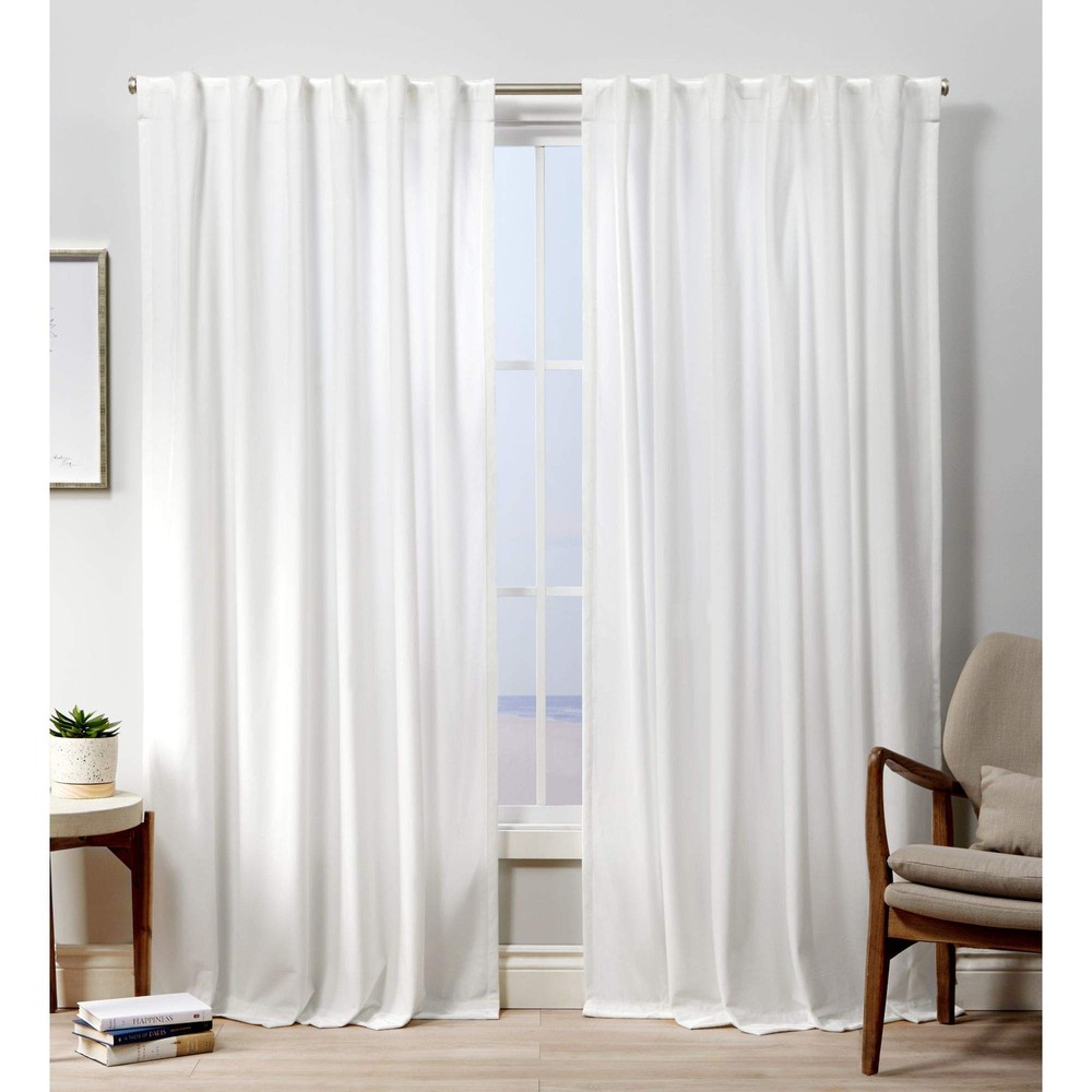 Exclusive Home Velvet Heavyweight Light Filtering Tab Top Curtain Panel Pair,...