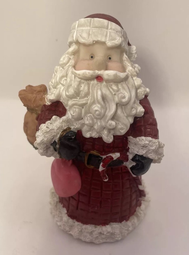 Santa Holding a Heart and a Bag of Toys Figurine Christmas Decor